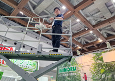 The sky is not the limit for Masato Sasai of Minoru whilst showcasing their scissor lifts at the show