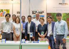 The Tomita booth presenting their IOT software and greenhouse solutions with Hiraaki Tomita and his wife pictured on the second from the right side