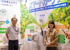 Tohru Morimoto and Rina Fujita with Honest demonstrating their monitoring devices to help farmers automate their greenhouse operations